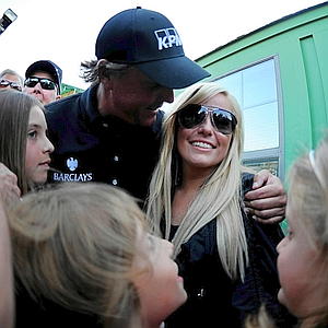 Phil Mickelson celebrates with his wife after winning the Masters in April of 2010